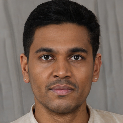 Neutral latino young-adult male with short  black hair and brown eyes