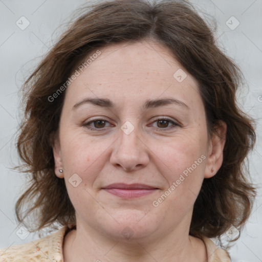 Joyful white adult female with medium  brown hair and brown eyes