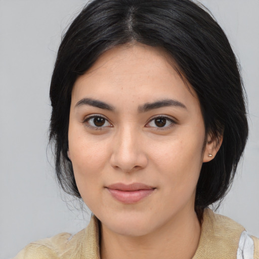 Joyful white young-adult female with medium  black hair and brown eyes