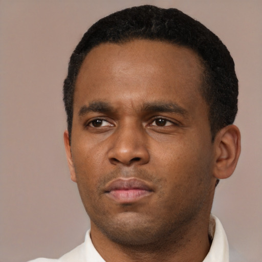 Neutral black young-adult male with short  black hair and brown eyes