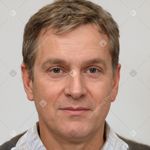 Joyful white adult male with short  brown hair and grey eyes