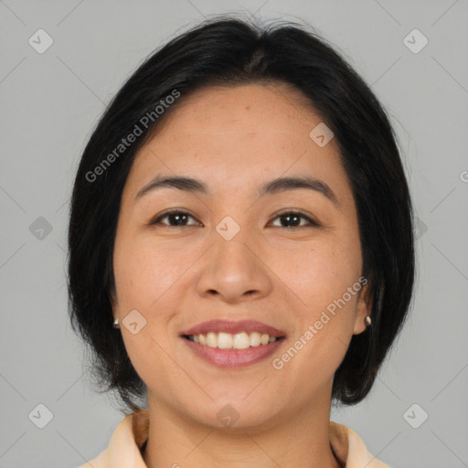 Joyful asian young-adult female with medium  black hair and brown eyes