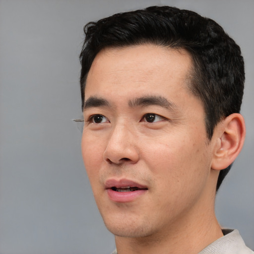 Neutral asian young-adult male with short  black hair and brown eyes
