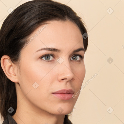 Neutral white young-adult female with long  brown hair and brown eyes