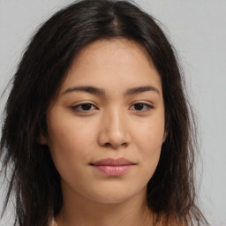 Joyful asian young-adult female with long  brown hair and brown eyes