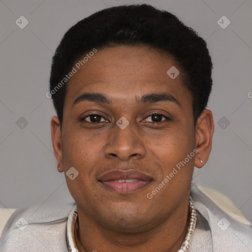Joyful black young-adult male with short  brown hair and brown eyes