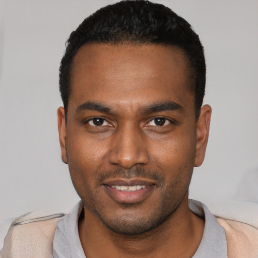 Neutral black young-adult male with short  black hair and brown eyes