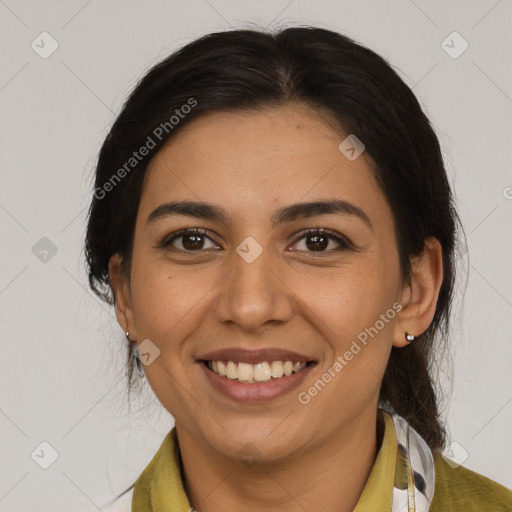 Joyful latino young-adult female with medium  brown hair and brown eyes