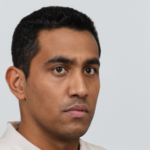 Neutral latino young-adult male with short  black hair and brown eyes
