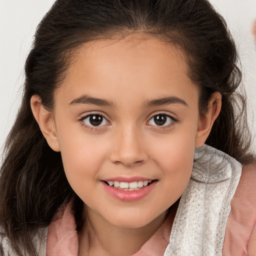 Joyful white child female with long  brown hair and brown eyes