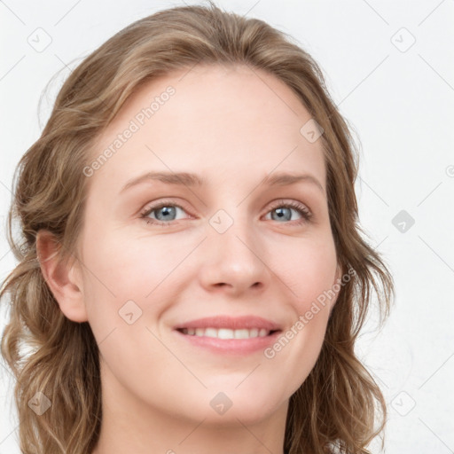 Joyful white young-adult female with long  brown hair and blue eyes