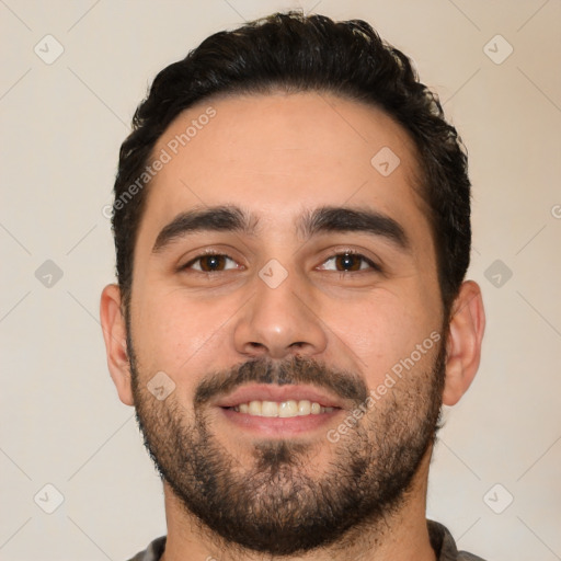 Joyful white young-adult male with short  black hair and brown eyes