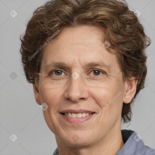 Joyful white adult female with short  brown hair and grey eyes