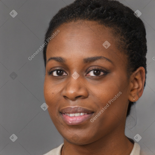 Joyful black young-adult female with short  brown hair and brown eyes