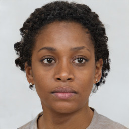 Neutral black young-adult female with short  brown hair and brown eyes