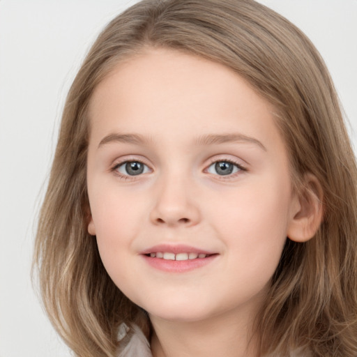 Joyful white child female with long  brown hair and grey eyes