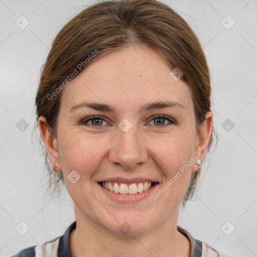 Joyful white young-adult female with medium  brown hair and grey eyes