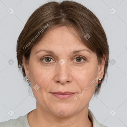 Joyful white adult female with medium  brown hair and grey eyes