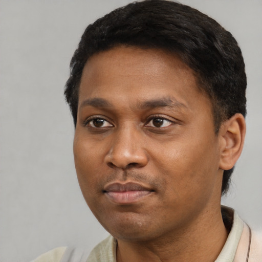 Neutral black young-adult male with short  black hair and brown eyes