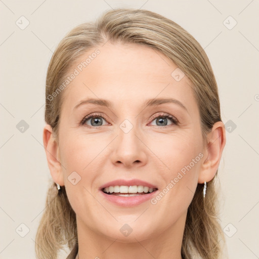 Joyful white young-adult female with medium  brown hair and blue eyes