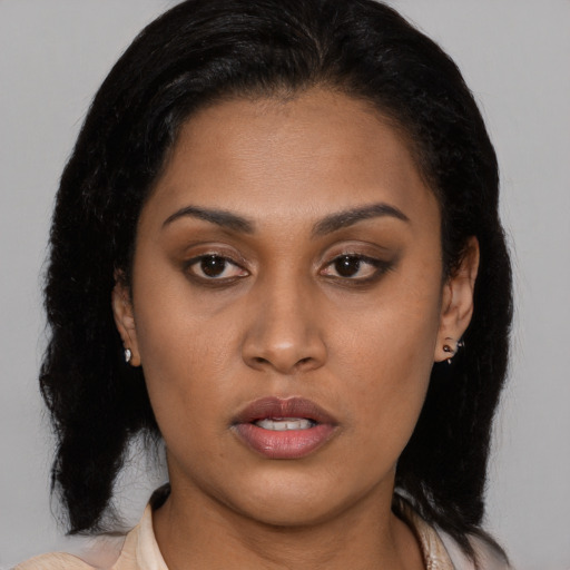 Neutral latino young-adult female with medium  brown hair and brown eyes