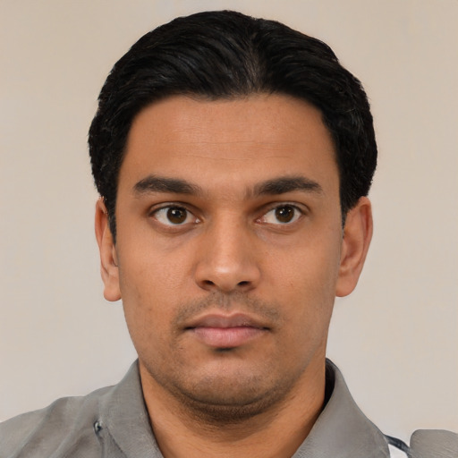 Neutral latino young-adult male with short  black hair and brown eyes