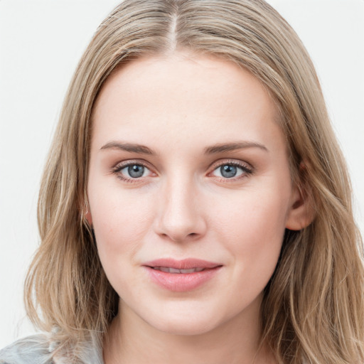 Joyful white young-adult female with long  brown hair and blue eyes