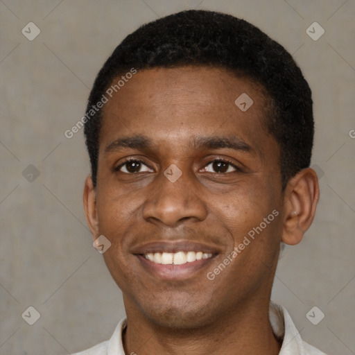 Joyful black young-adult male with short  brown hair and brown eyes