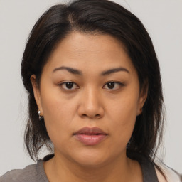 Neutral asian young-adult female with medium  brown hair and brown eyes