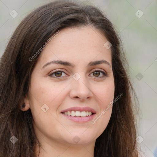 Joyful white young-adult female with long  brown hair and green eyes