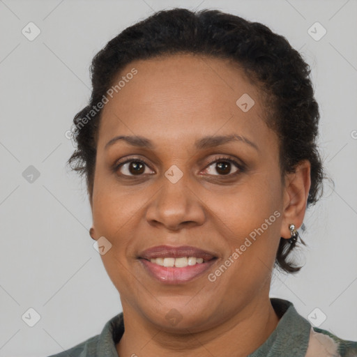 Joyful black adult female with short  brown hair and brown eyes