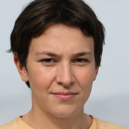 Joyful white adult female with short  brown hair and brown eyes