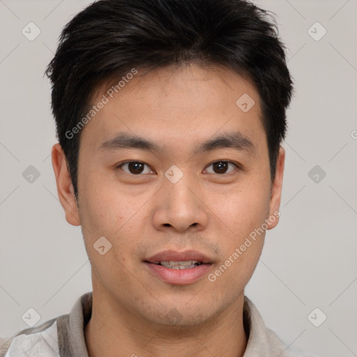 Joyful asian young-adult male with short  brown hair and brown eyes