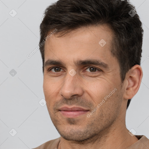 Joyful white adult male with short  brown hair and brown eyes