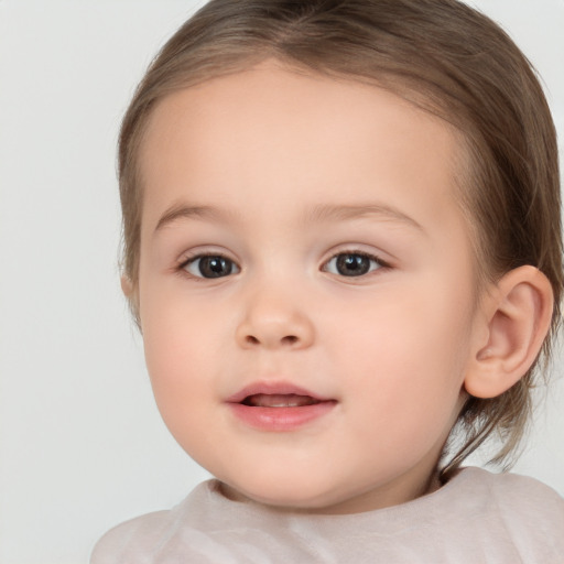 Joyful white child female with medium  brown hair and brown eyes