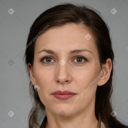 Joyful white adult female with medium  brown hair and brown eyes