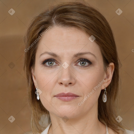 Joyful white adult female with medium  brown hair and grey eyes