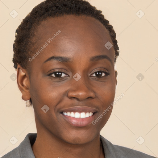 Joyful black young-adult female with short  brown hair and brown eyes