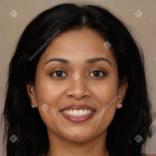 Joyful latino young-adult female with long  brown hair and brown eyes