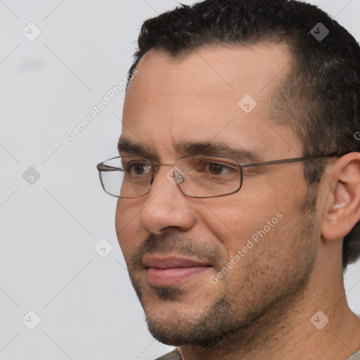 Joyful white young-adult male with short  black hair and brown eyes