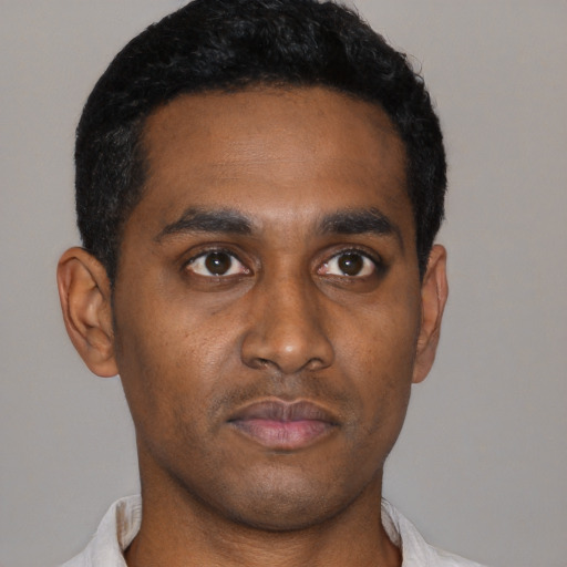 Neutral black young-adult male with short  black hair and brown eyes