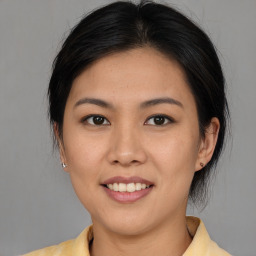 Joyful white young-adult female with medium  brown hair and brown eyes