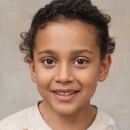 Joyful white child male with short  brown hair and brown eyes