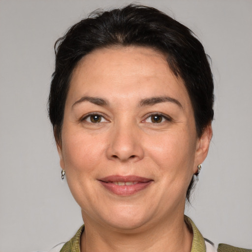 Joyful white adult female with short  brown hair and brown eyes