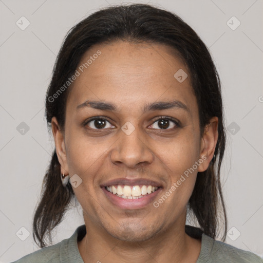 Joyful black young-adult female with medium  brown hair and brown eyes