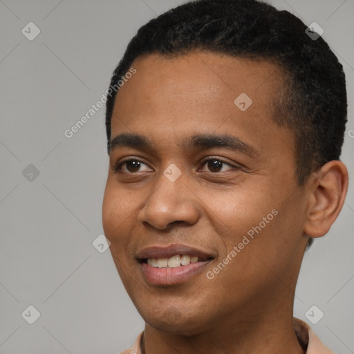 Joyful black young-adult male with short  black hair and brown eyes