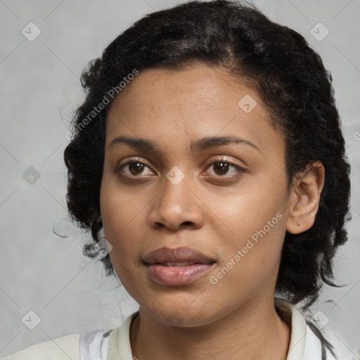 Joyful black young-adult female with medium  black hair and brown eyes