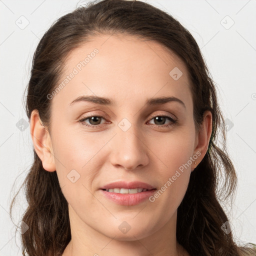 Joyful white young-adult female with medium  brown hair and grey eyes