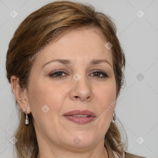 Joyful white adult female with medium  brown hair and grey eyes