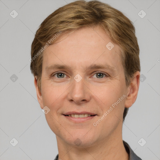 Joyful white adult male with short  brown hair and grey eyes